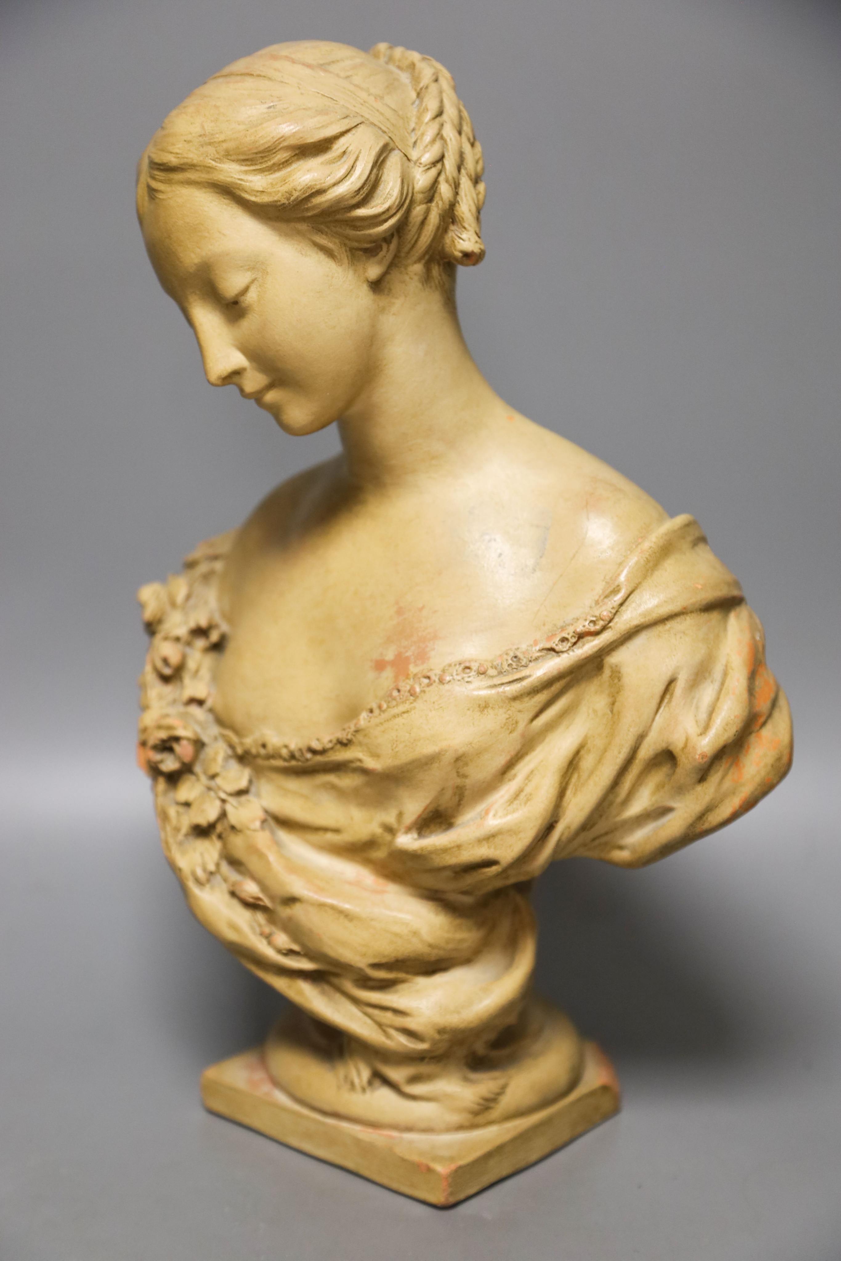 A cream painted terracotta bust of a lady 33cm